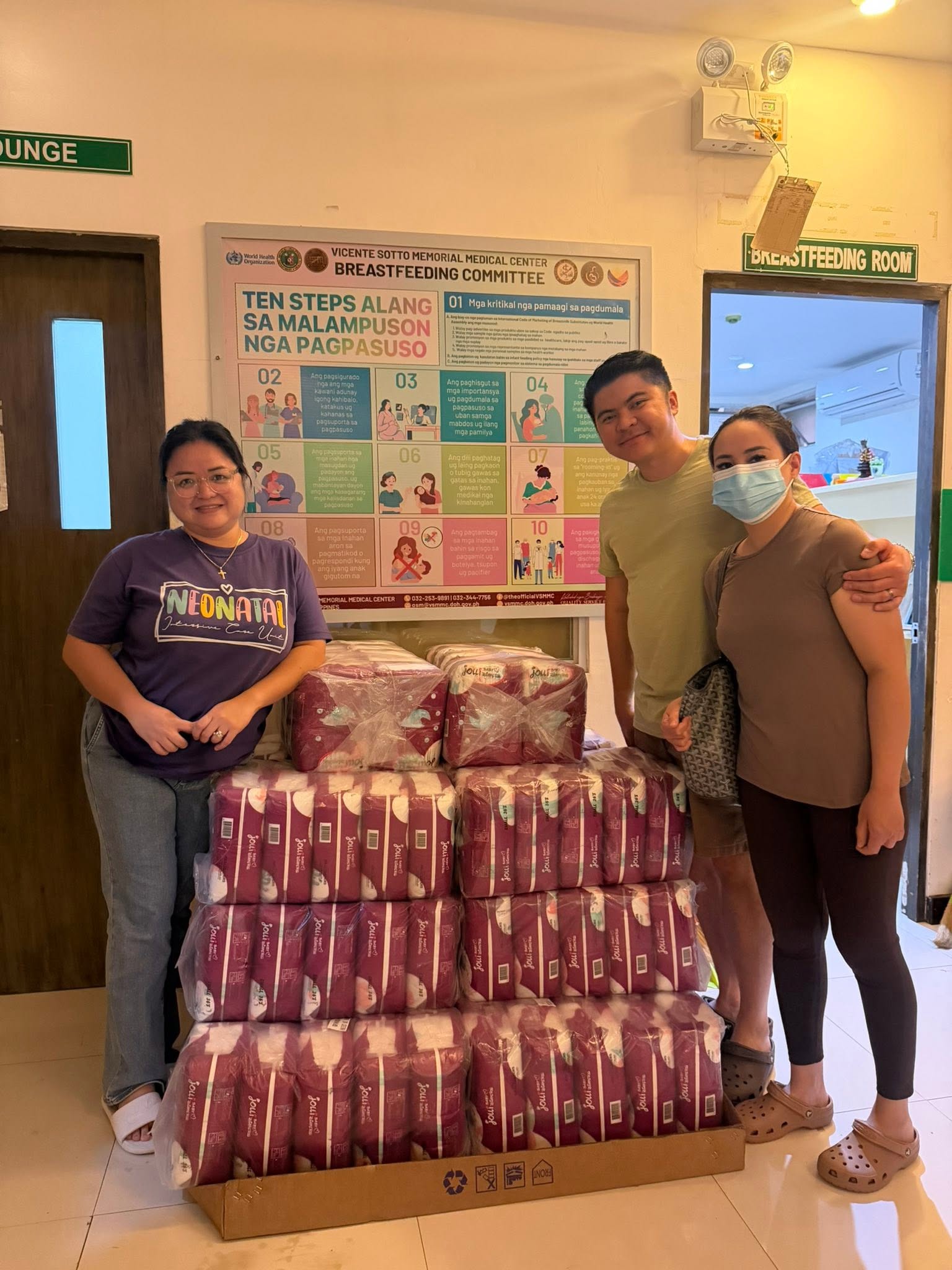 Foundation representatives with donated newborn diapers at Vicente Sotto Memorial Medical Center